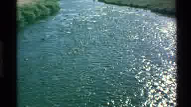 Western USA (1980): Water Blowing In A River On A Windy Day In A Big Field