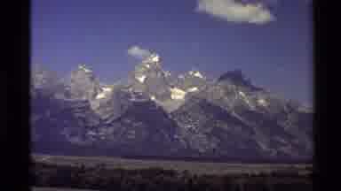 Western USA (1980): Large Mountains Cold Snowy Peaks Against Clear Blue Sky Across