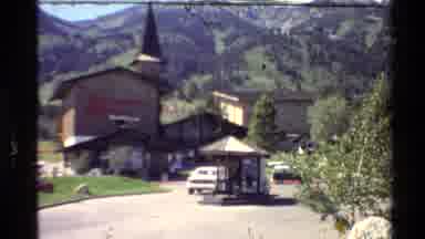 Western USA (1980): White Truck Driving In Front Of Jackson's Hole Tavern With