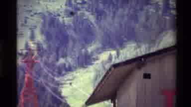 Western USA (1980): Zooming Footage Of Hilled Landscape Leading Up To A Mountain