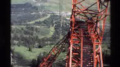 Western USA (1980): Aerial Red Cable Tower In The Forest With Plains In Background