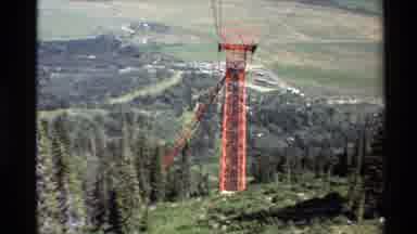 Western USA (1980): Riding A Chairlift Up A Ski Slope With No Snow Only Grass And