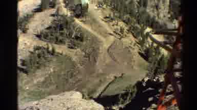 Western USA (1980): Wires Run Between Elevated Red Electrical Transmission Tower