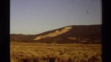 Western USA (1980): Grasstop Hill Like Mountain In An Open Field On A Summer Day