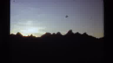 Western USA (1980): Silhouette Of Mountain Peaks And Sun Setting Behind Them