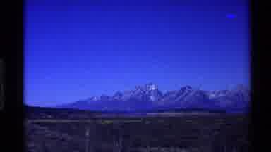 Western USA (1980): Scene Of Grassland And Distant Mountains Covered In Snow On A