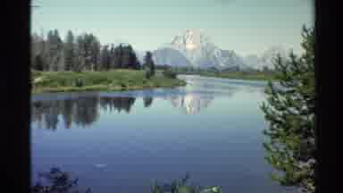 Western USA (1980): Clear Water River With Trees Around It With A Mountain In The