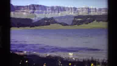 Western USA (1980): Lakeshore Located In Valley Surrounded By Mountains And Forest