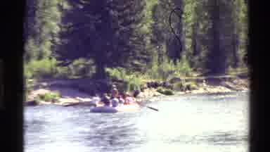 Western USA (1980): Group Of People Are Crossing A River On Boat