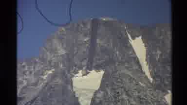 Western USA (1980): A Partially Snow Capped Mountain Top On A Clear Day