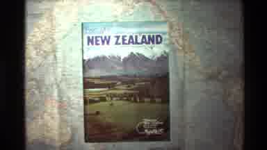 New Zealand (1981): Travelers Book Of New Zealand On Top Of A Map