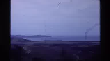 New Zealand (1981): The Sea Surrounded By Rocky Shore And The Sky Is Clouded