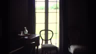 New Zealand (1981): Close-Up To A Chain In Front Of A Window With Sunny Summer Day