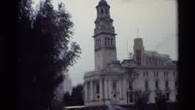 New Zealand (1981): An Old Building With People Feeding Pigeons