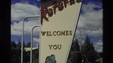 New Zealand (1981): White Background Welcoming Sign Board With Logo Plants River