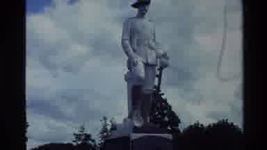 New Zealand-1981: Reverently Observing A Tall Statue Monument And Artistic Garden