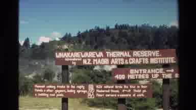 New Zealand (1981): Park Signs In Front Of Steaming Geyser Followed By Closeup On