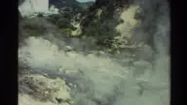New Zealand (1981): Woods With Waterfall And Smoke Along With Rocks