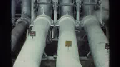 New Zealand (1981): Large Grey And White Industrial Pipes Surrounded By Forest Of