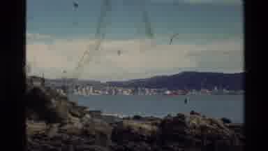 New Zealand (1981): People Traveling Through City Streets Taking A Trolley And