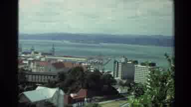 New Zealand (1981): Arial A Coastal Town And The Surrounding Mountains In The