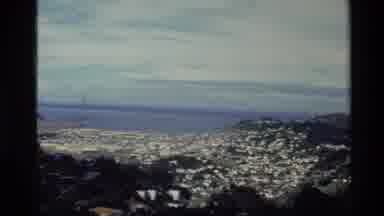 New Zealand (1981): A Coastline With Small Islands Visible In The Body Of Water