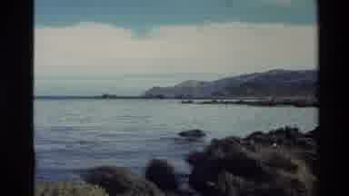 New Zealand (1981): Tides Of A Deep Blue Sea Surrounded By High Mountains Are