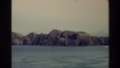 New Zealand (1982): Ocean Rocks And Island From A Running Boat