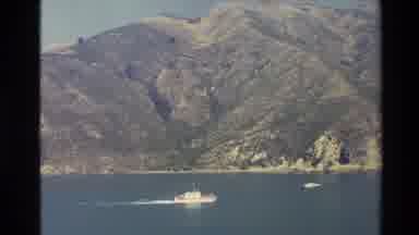New Zealand (1982): Beautiful Blue Lake Nestled Among Mountains With Boats Gliding
