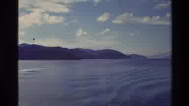New Zealand (1982): Mountains And Motorboat Skimming Calm Lake Water