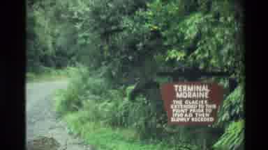 New Zealand (1982): A Brown Sign With White Lettering Standing On The Side Of A