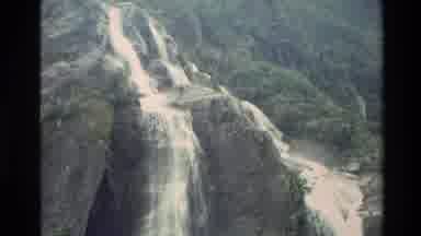 New Zealand (1982): Waterfall Streaming From A Rocky Mountain On An Island
