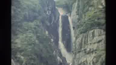New Zealand (1982): Water Rapidly Flows Through Gorge Between Two Rocky Mountains
