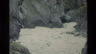 New Zealand (1982): Muddy Rapid River Flowing Between A Canyon With Rocks On Both