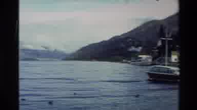 New Zealand (1982): Fishing Village By Lake With Boats And Surrounding Mountains