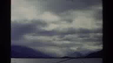 New Zealand (1982): Zoom In To Clouds And Blue Skies And Trees And Mountains