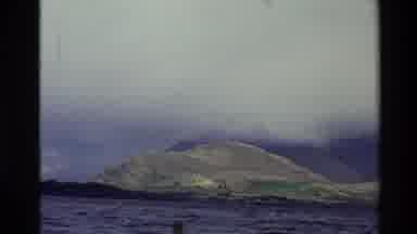 New Zealand (1982): Shot Of Hills Covered In Cloud From Across A Very Wide Like