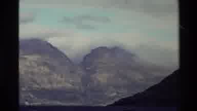 New Zealand (1982): Small Village With Mountains Foggy Misty On The Top Of