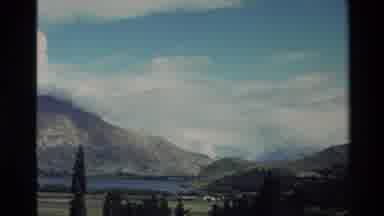New Zealand (1982): Mountains Across A Lake On A Bright But Cloudy Day