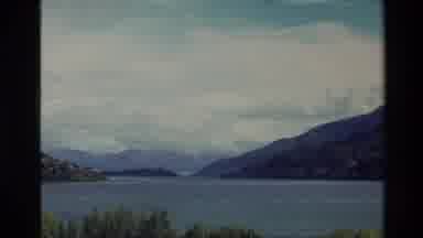 New Zealand (1982): Clouds Hovering Over A Pretty Blue Lake Surrounded By Trees