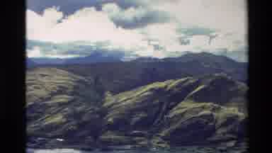 New Zealand (1982): Mountainous Region With Fluffy White Clouds Over Head And A