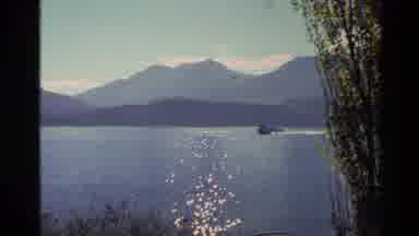 New Zealand (1982): Motorboat Skimming On Calm Lake Water On Bright Sunny Day