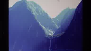 New Zealand (1982): Mountain Peaks With Waterfall Pouring Into Lake At Summit