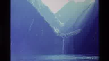 New Zealand (1982): Macro Waterfall And Cliffs With A Goat Sitting On Banks Of A