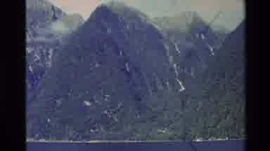 New Zealand (1982): Towering Snow Capped Green Mountains Towering Above Short
