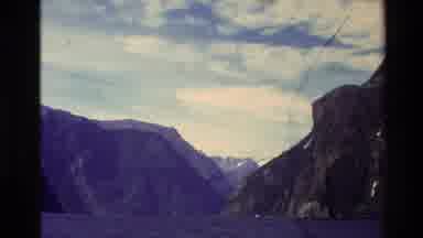 New Zealand (1982): Several Green Rocky Mountain Ranges Surrounded By Water On