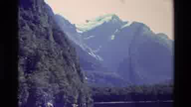 New Zealand (1982): Snow Covered Mountain Slope And Trees By Lake On Clear Winter