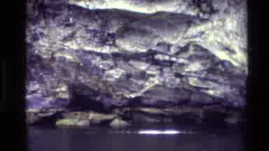 New Zealand (1982): Panning Shot Of Mountains Shrouded In Clouds With Closeup Of