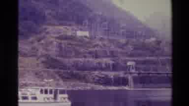 New Zealand (1982): Passengers Walk Down A Dock Toward A Large Boat Docked In A