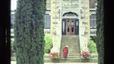 New Zealand (1982): Lady In A Red Jacket Walking Up Steps To A Beautiful Castle